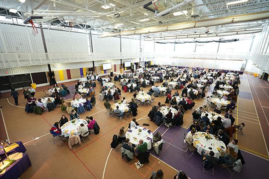 several people sitting at tables for lunch